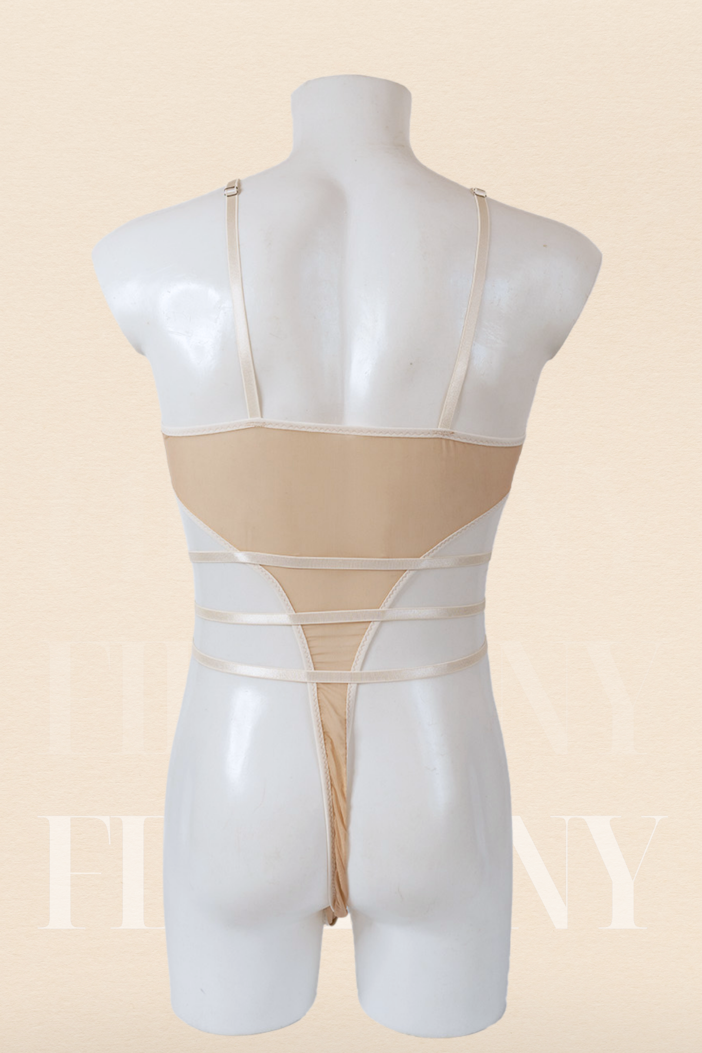 Back view of nude sheer men’s bodysuit with thong back and multiple waist straps.