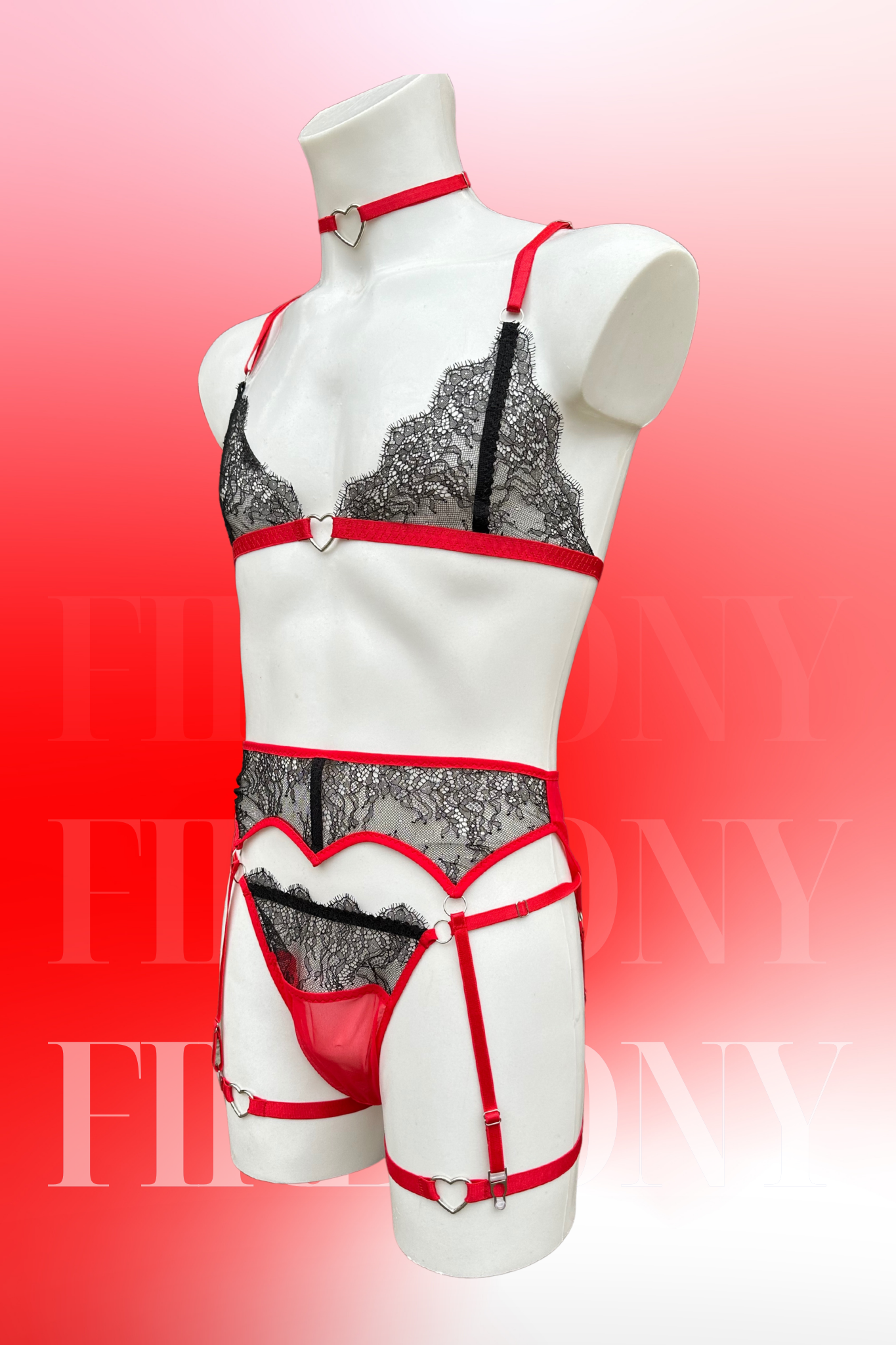 Side view of the same set highlighting the lace bra, sheer thong, and heart-accented garter straps.