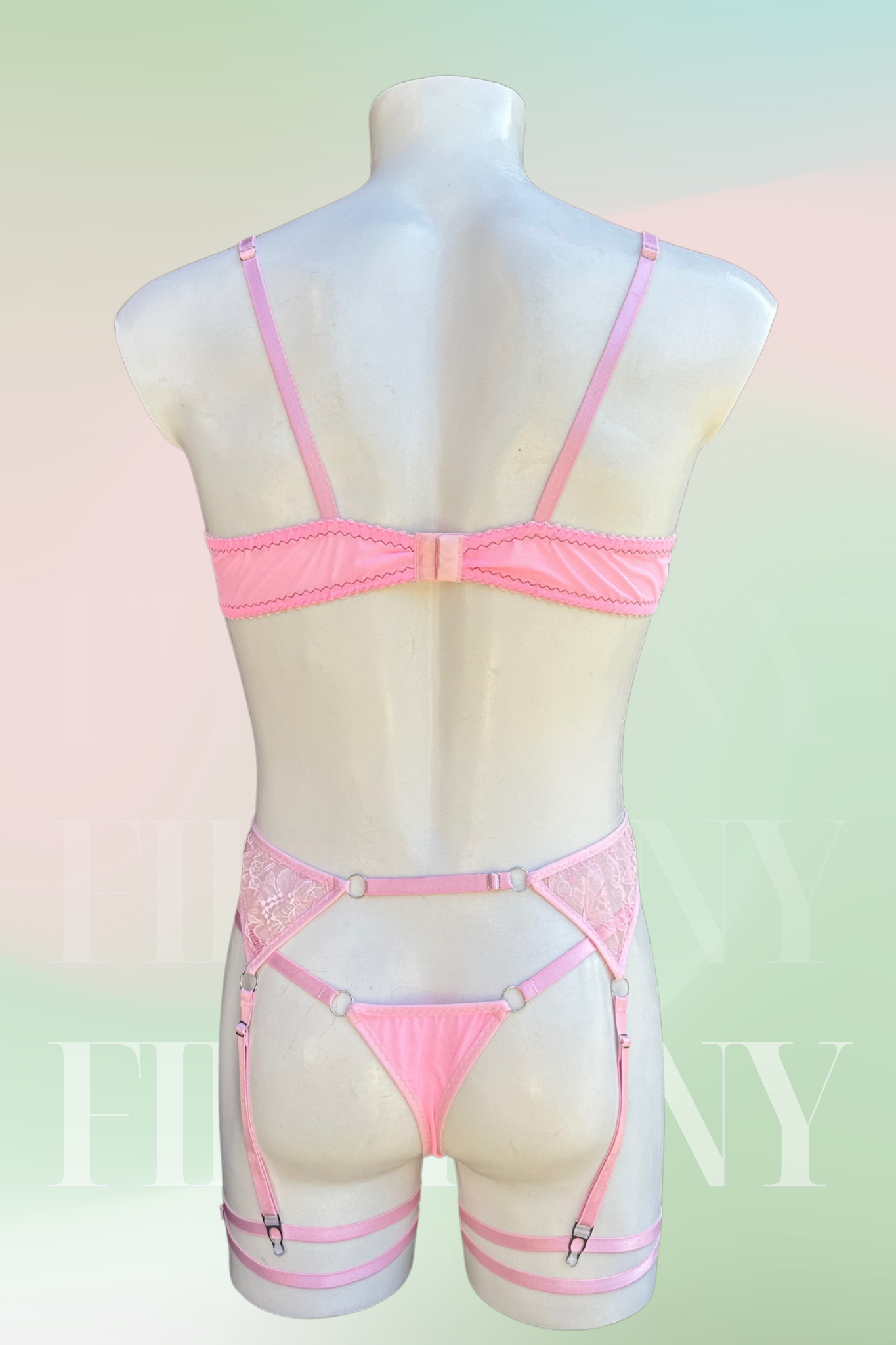 Back view showing the adjustable bra, thong, and strappy garter harness.