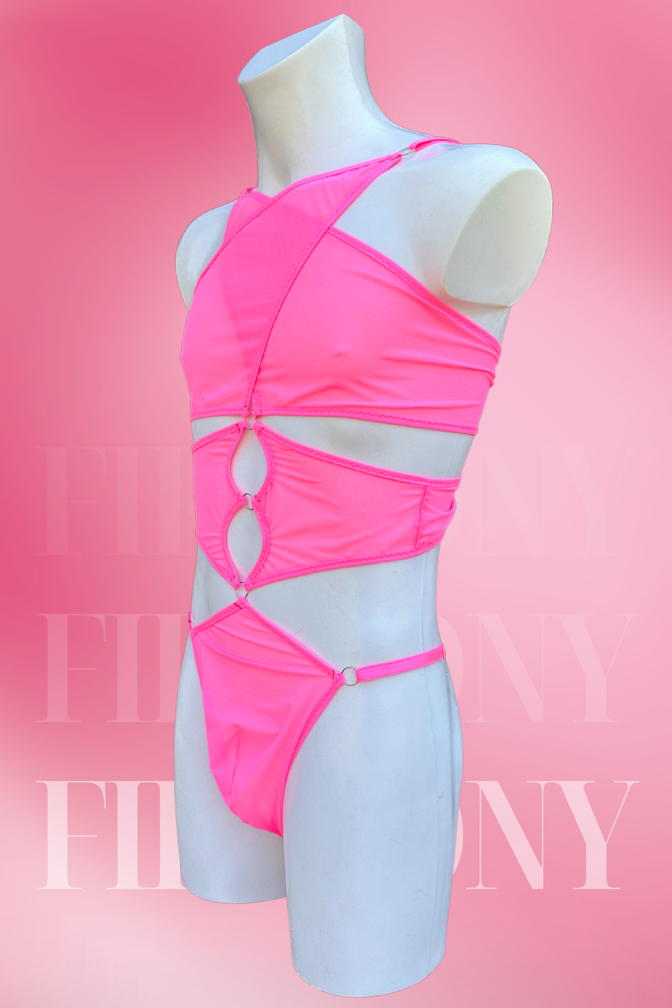 Side angle of men’s pink mesh bodysuit featuring see-through fabric and thong back