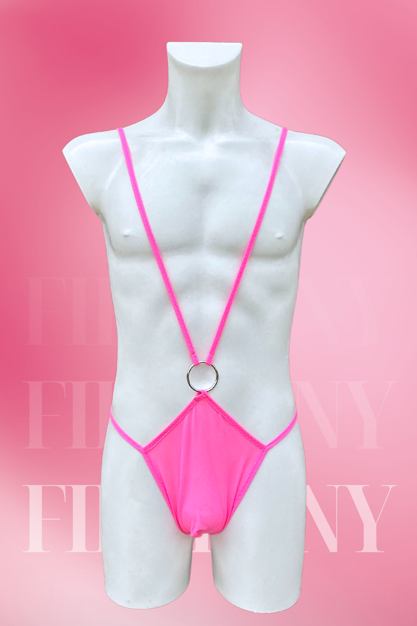 Neon pink men's sling bodysuit with O-ring front detail and extreme micro thong cut, displayed on a mannequin against a pink background.