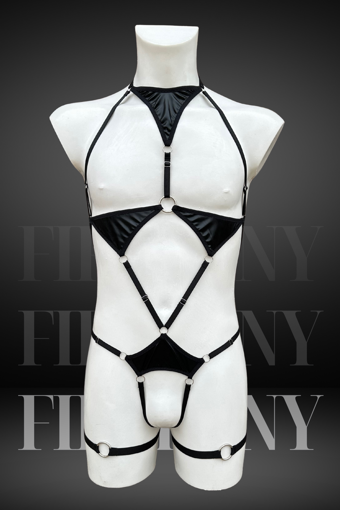 Front view of a black wetlook harness-style bodysuit for men with cut-out details and triangle panels.