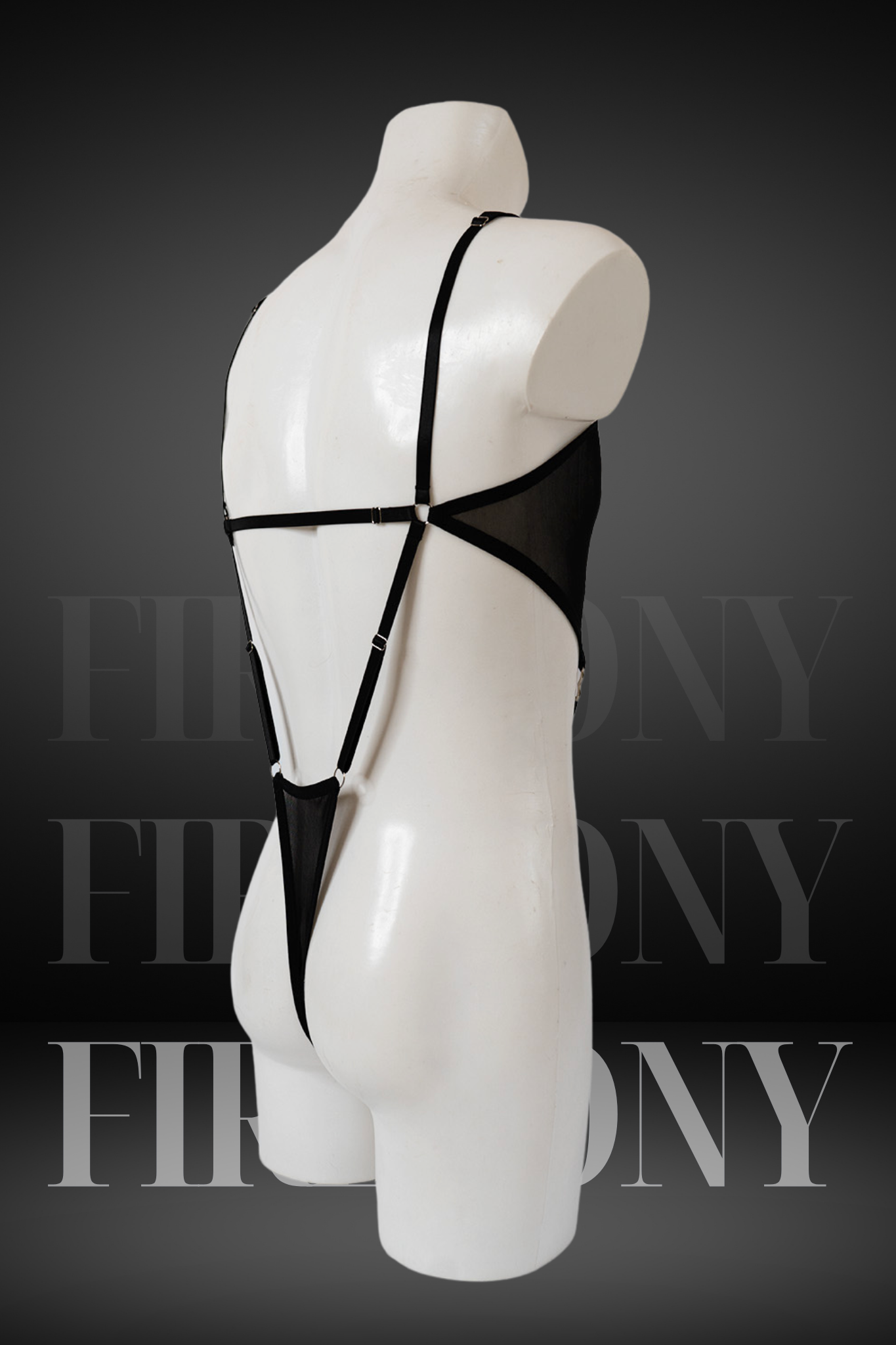 Angled side view of black sheer cut-out men’s lingerie one-piece