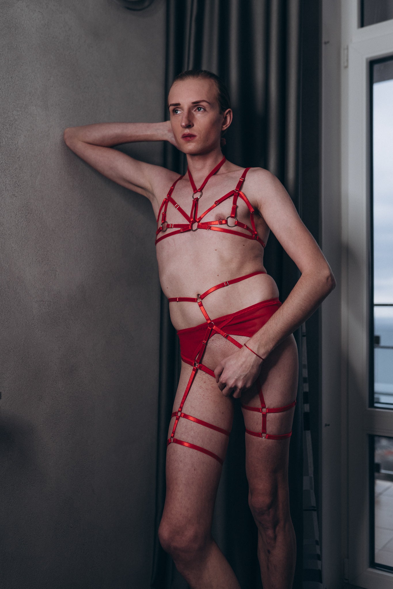 Close-up of silver o-rings and sliders on red harness set