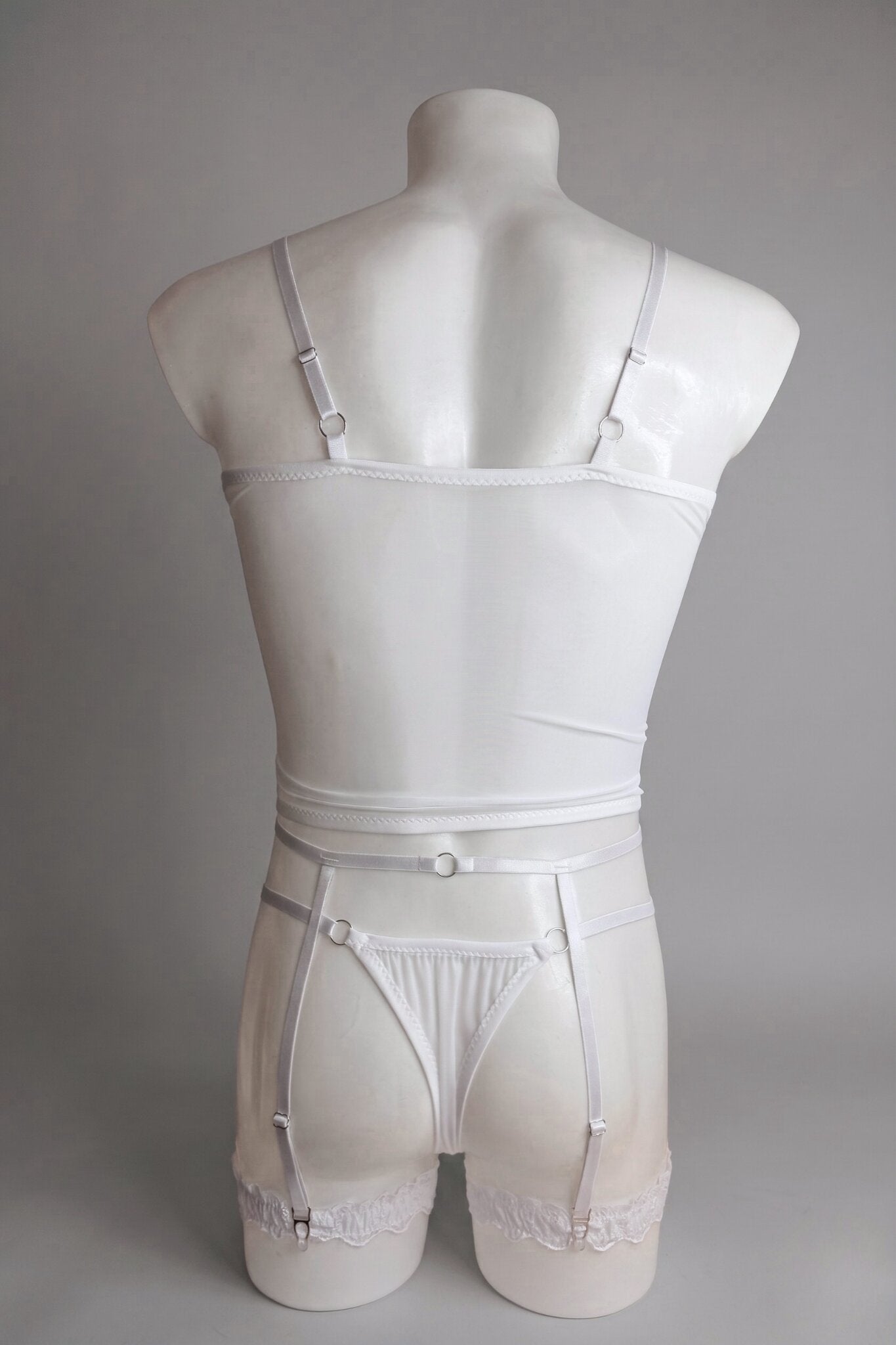 Back view of men's white mesh corset top set - sheer top, thong back and adjustable suspender straps