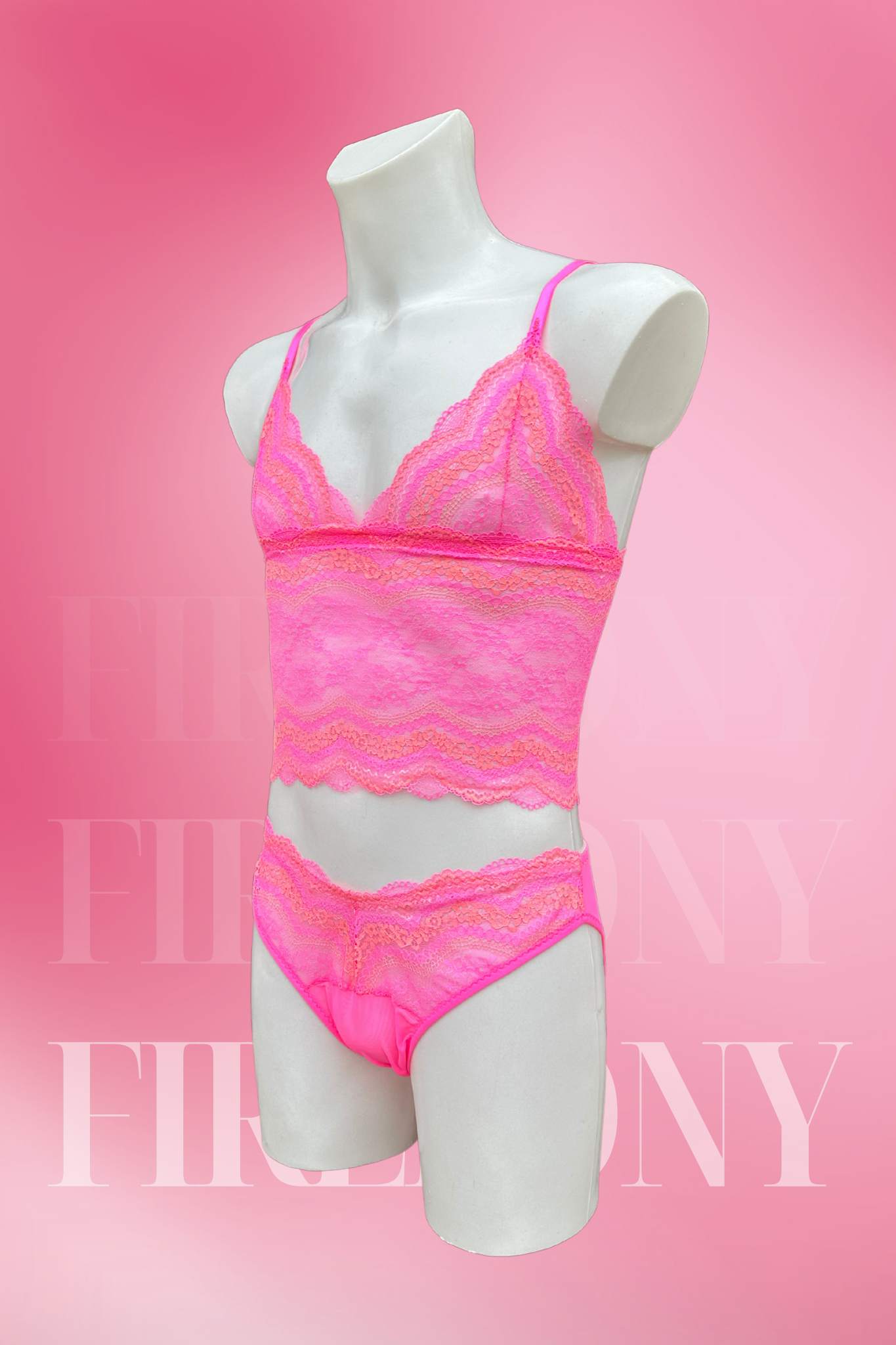 Angled back view of the lace bralette and panties set for men in vibrant pink.

