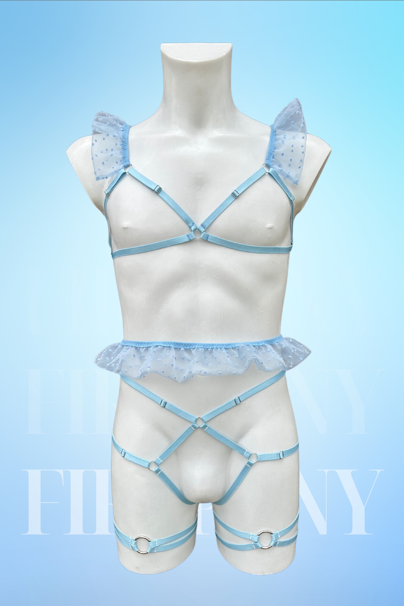 Front view of a baby blue femboy lingerie set with ruffled shoulders, peplum waist, and strappy thong on a male mannequin.