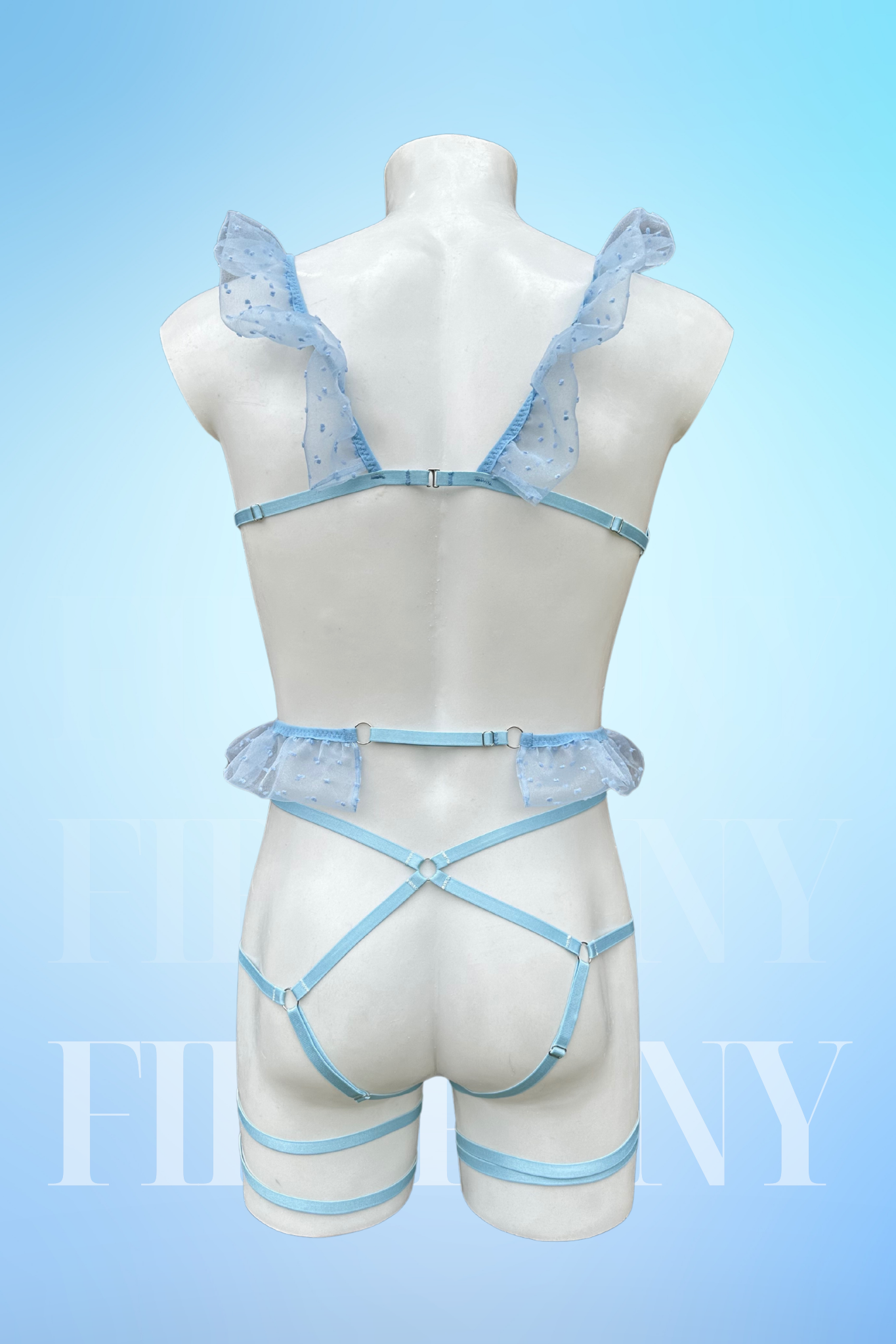 Back view of the lingerie set highlighting the thong design and ruffled shoulder straps.