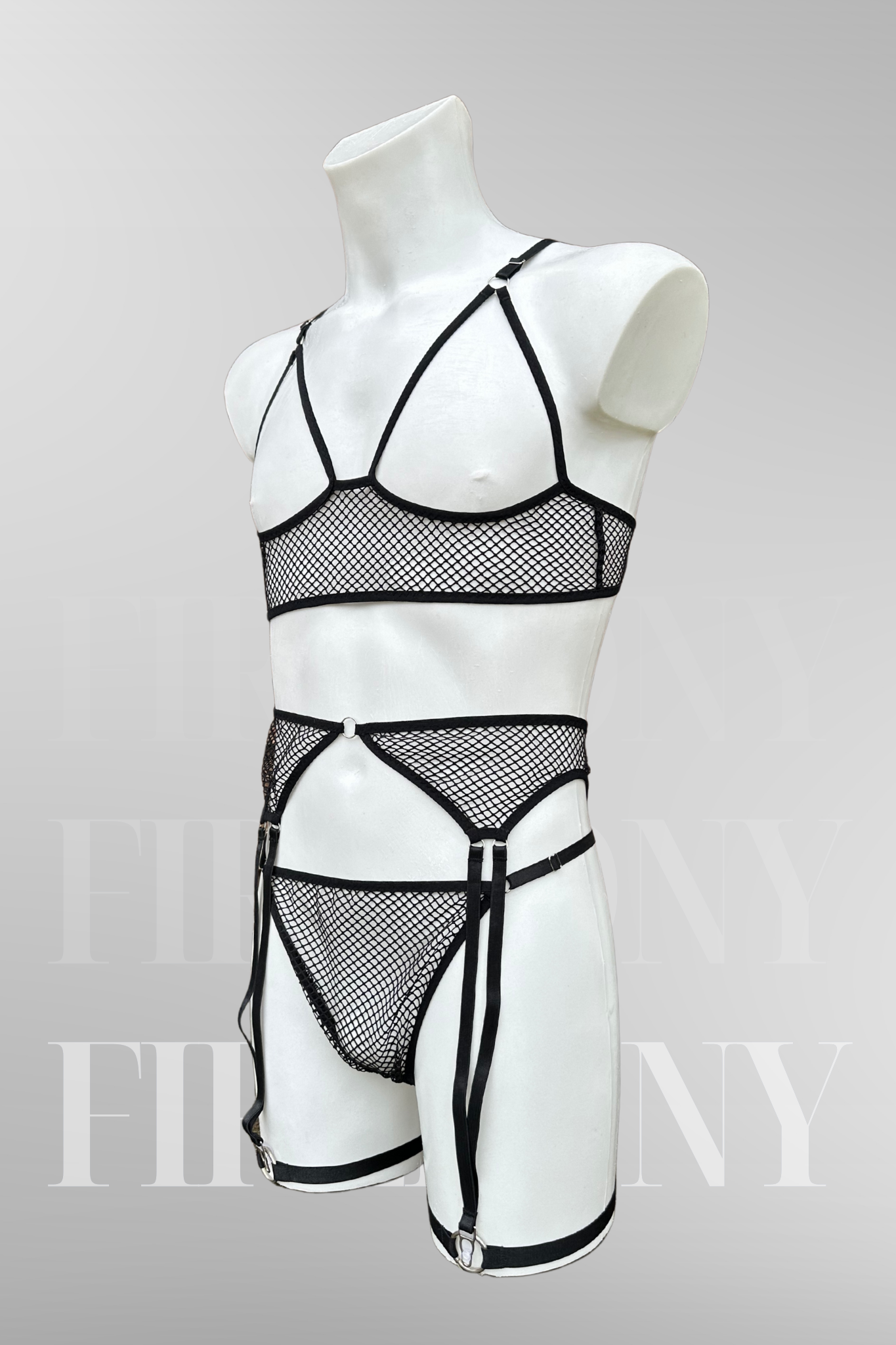  Angled back view focusing on the fishnet material, garter straps, and thong fit.

