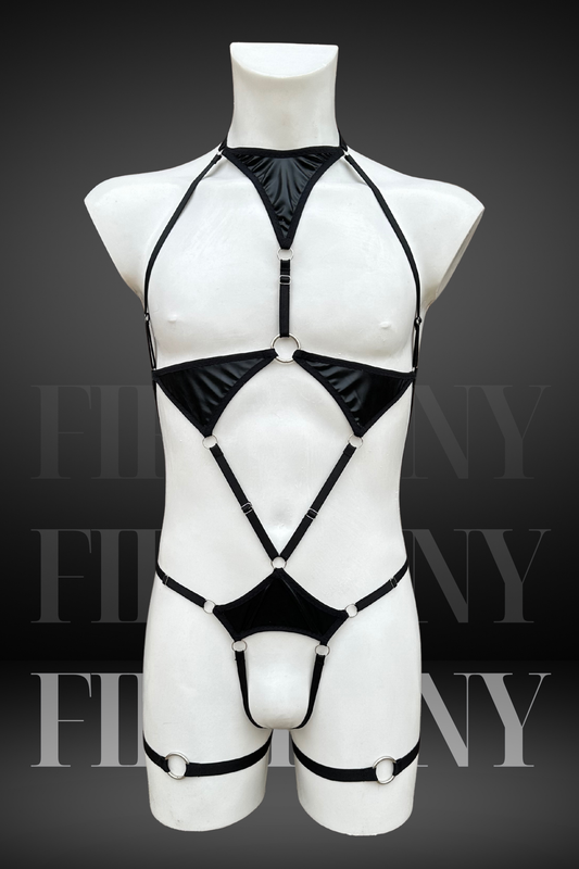 Front view of a black wetlook harness-style bodysuit for men with cut-out details and triangle panels.