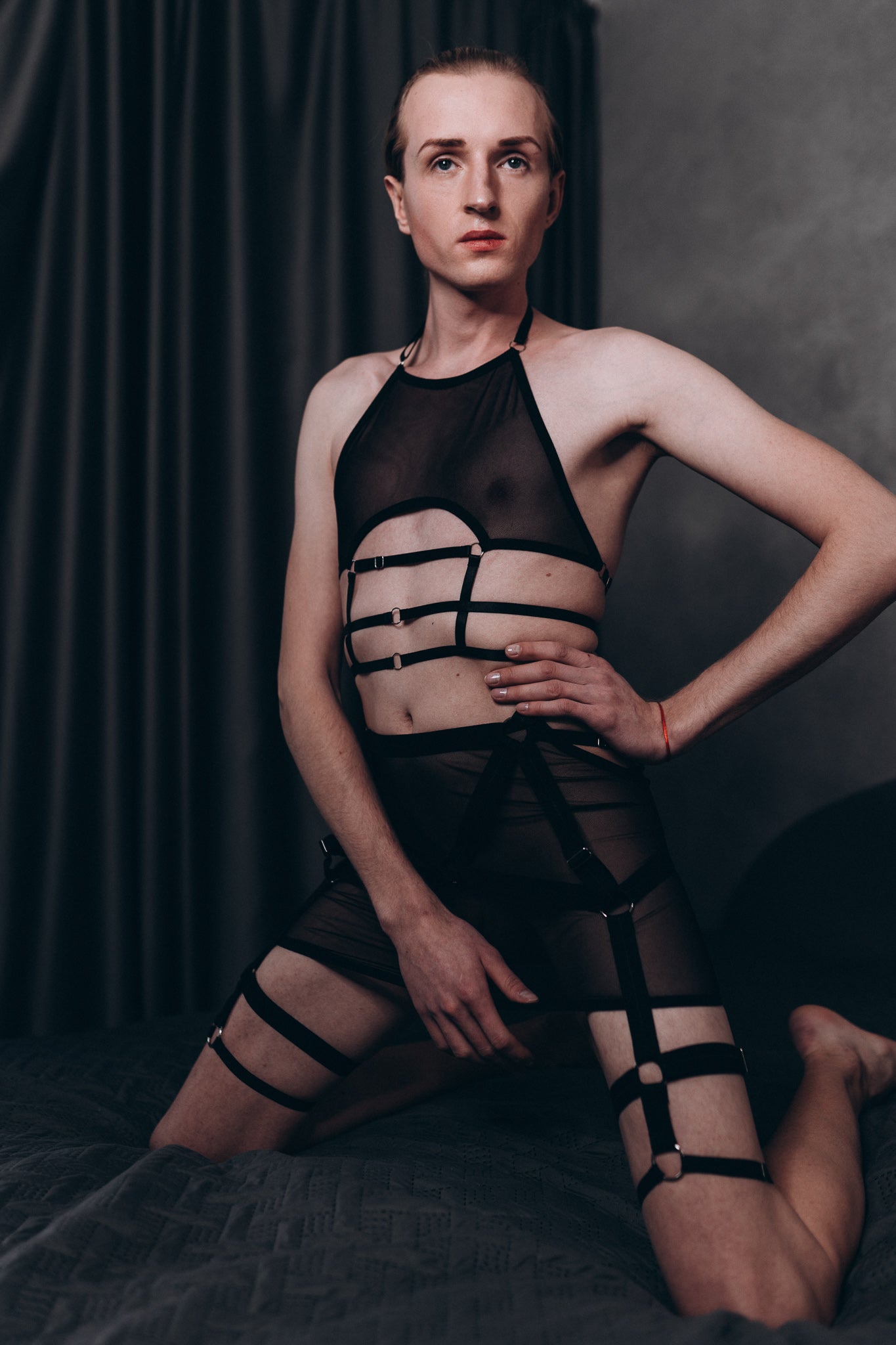 Men’s black mesh skirt with matching bra and leg harness, part of Fireponyshop’s fetish underwear collection.