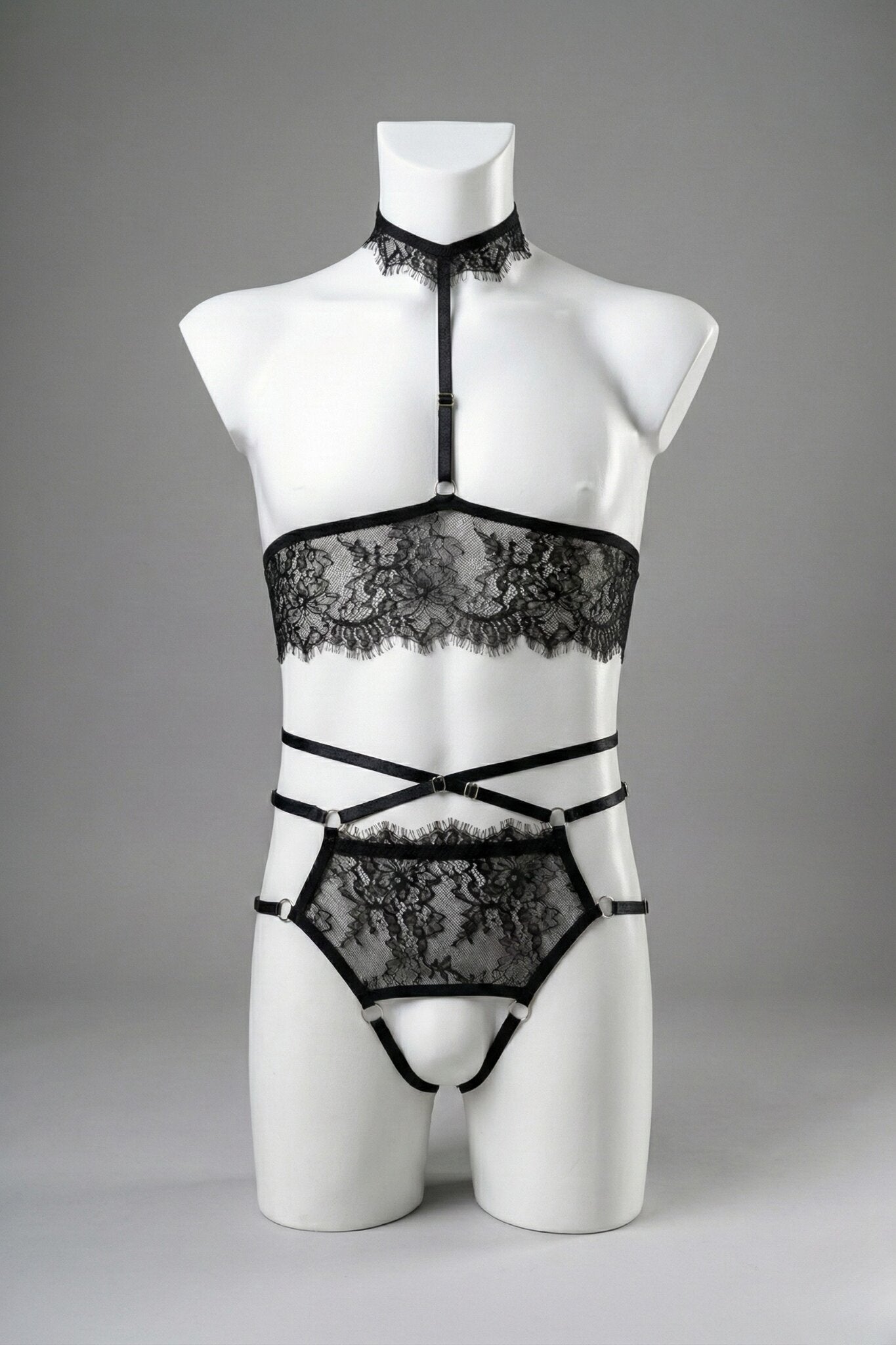 Black lace ouvert lingerie set for men on mannequin - cupless bandeau top with lace choker and open panties, front view