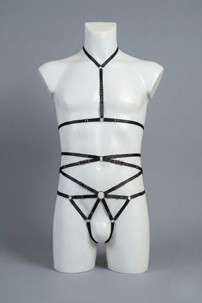 Black strappy body harness set for men on mannequin - choker harness top and open-frame harness bottom with silver o-rings, front view