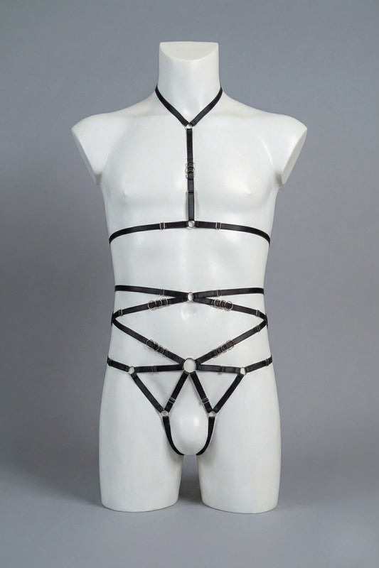 Black strappy body harness set for men on mannequin - choker harness top and open-frame harness bottom with silver o-rings, front view
