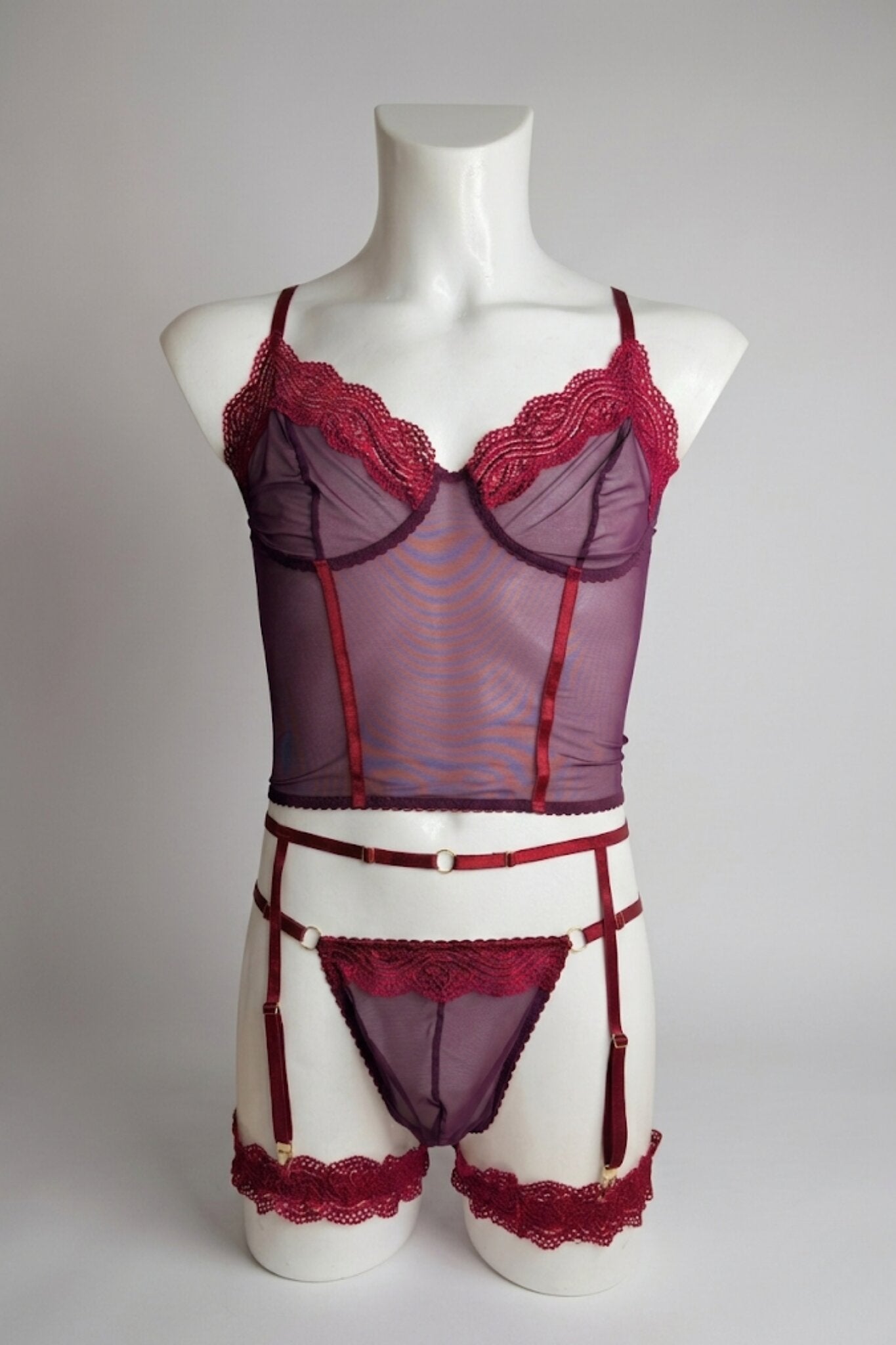 Burgundy corset-style mesh top set for men on mannequin - plum mesh with wine lace trim and gold hardware, front view