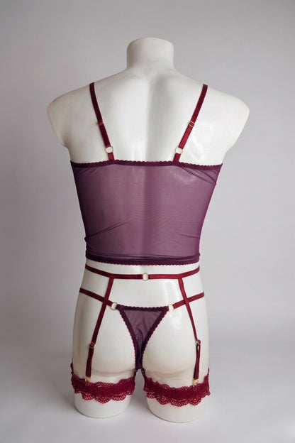 Back view of men's burgundy mesh corset top set - sheer plum top, thong back and adjustable suspender straps with gold rings
