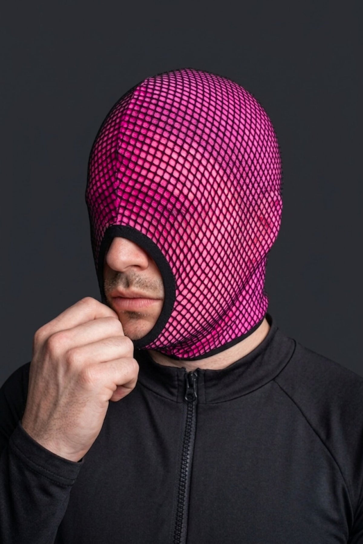 Side view of hot pink fishnet balaclava - double layer mesh hood with black binding