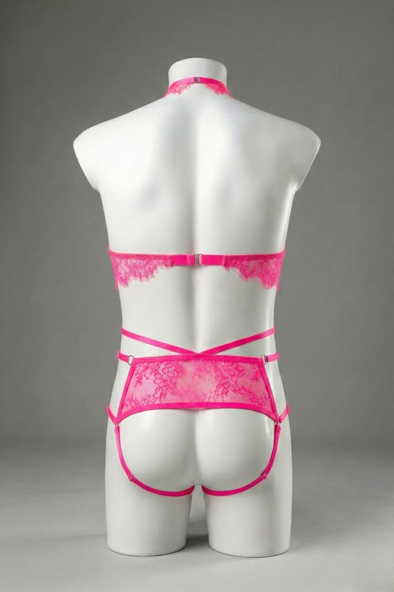 Back view of men's hot pink lace ouvert set - lace back panel, open cut and adjustable straps