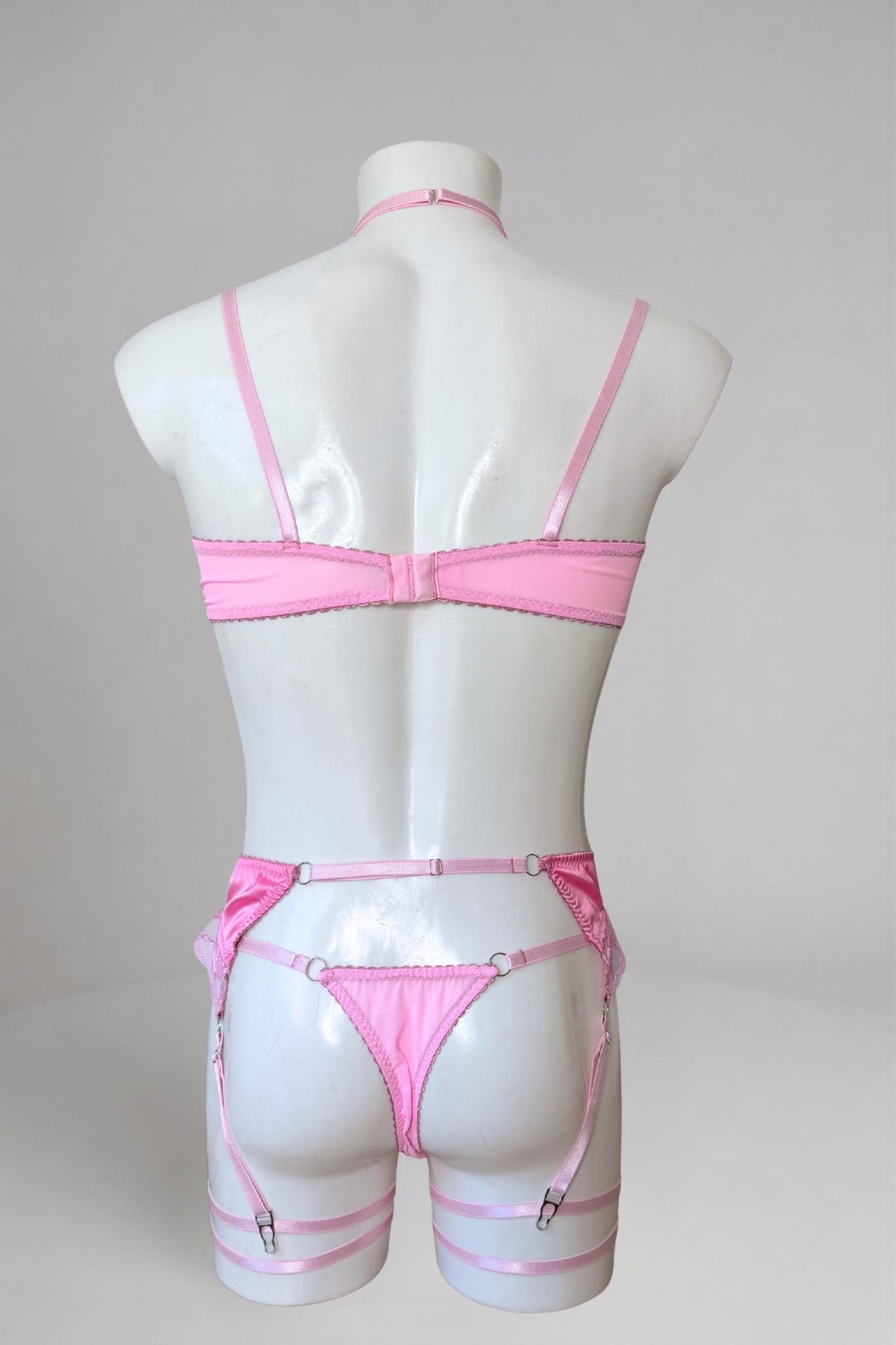 Pink heart lace lingerie set for men - back view: bra closure, satin garter belt and thong