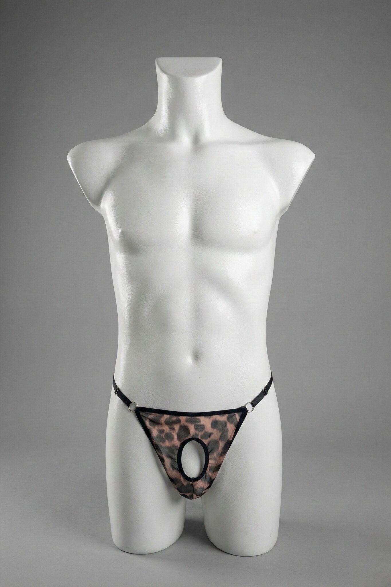 Leopard print mesh ouvert thong for men on mannequin - peekaboo front opening with black trim and silver o-rings