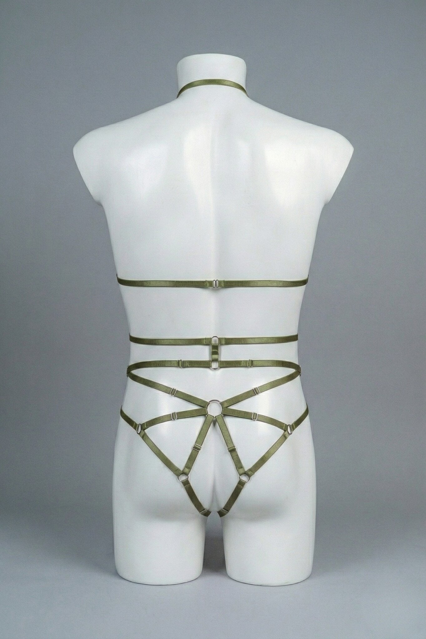 Back view of men's olive strappy body harness set - crossing waist straps and open-frame back with o-rings