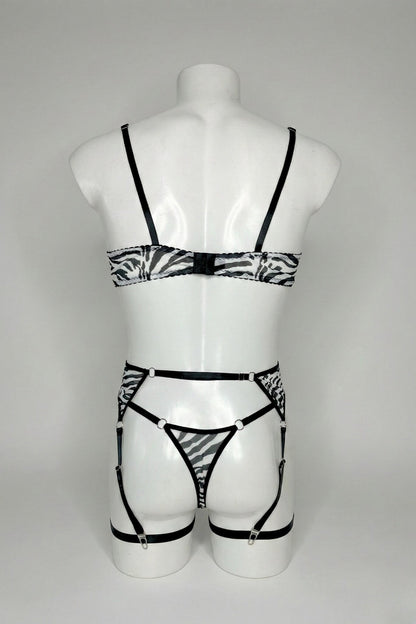Back view of men's zebra mesh lingerie set - bra hook closure, thong back and adjustable suspender straps